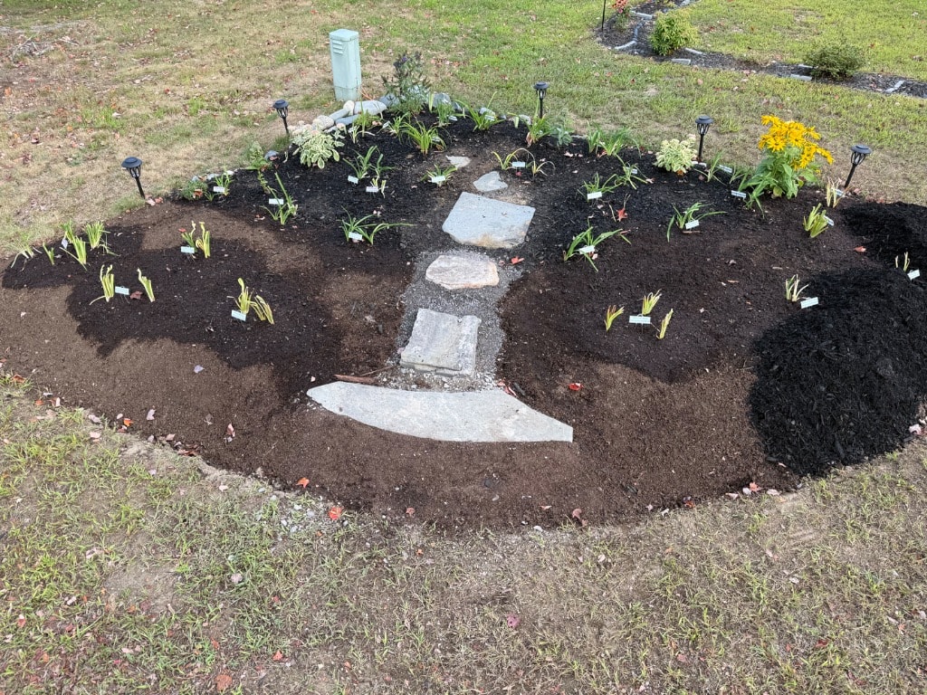 Expanded garden with stepping stones and new plantings